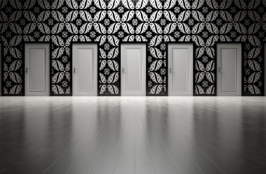 Five closed doors in a black and white ornate hallway symbolizing opportunities and decisions.